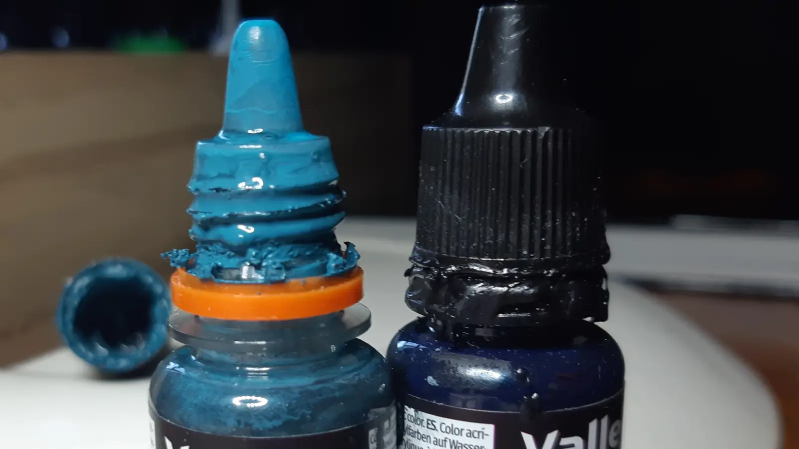 Dried paint residue on dropper bottle