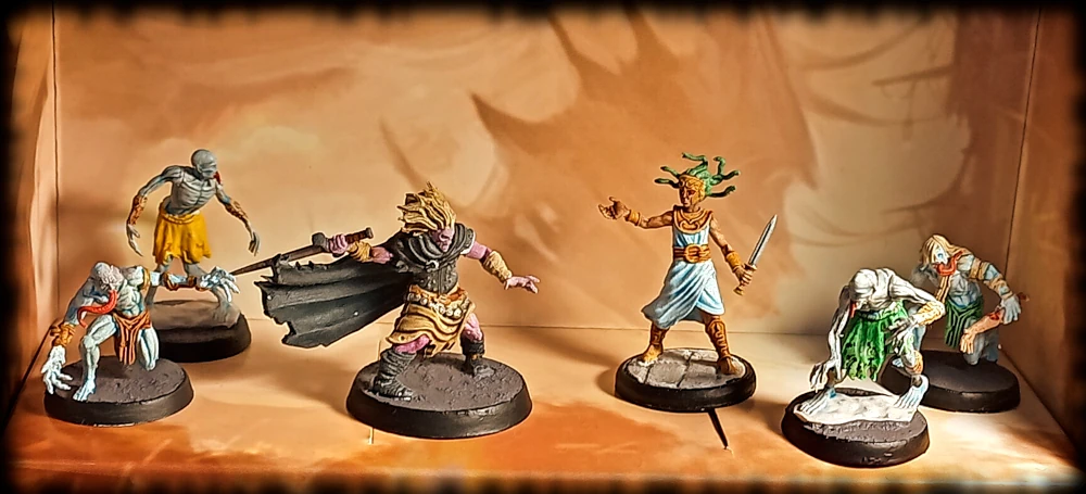 A wight wielding a sword, a gorgon in decorative armour, and a bunch of ghouls and ghasts.