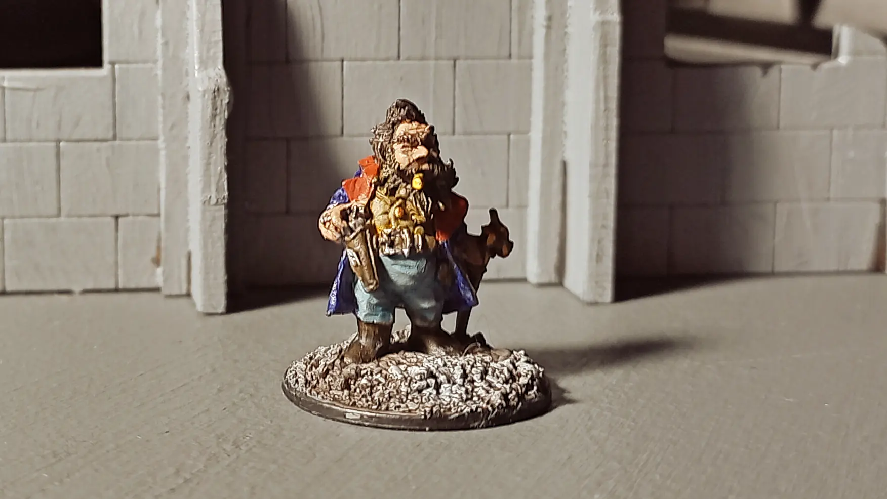 Olav Gunderson is a dapper dwarf in fine clothes with an ornate walking stick. He is a metal miniature by Reaper.
