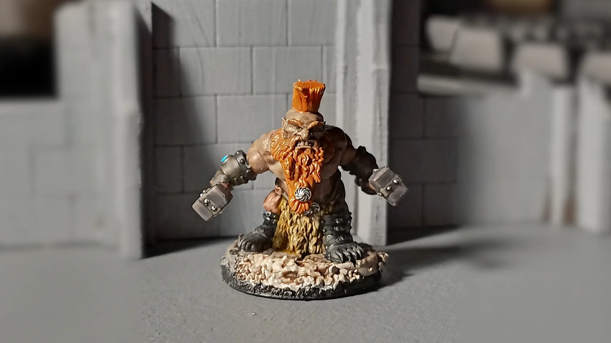 Dorn Ironspike is a plastic miniature by Reaper, with two warhammers and a mohawk.