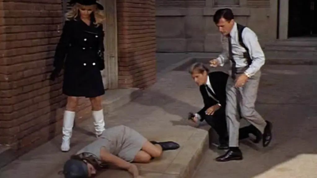 Andy, Napoleon, and Illya look at a defunct Muriel.